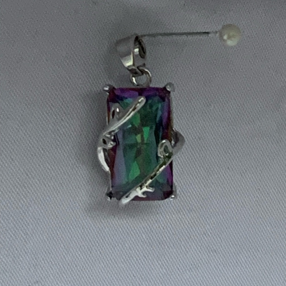 Topaz pendant with silver vines.